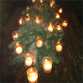 Jens Jakobson Christmas: tealights and evergreen full table arrangement